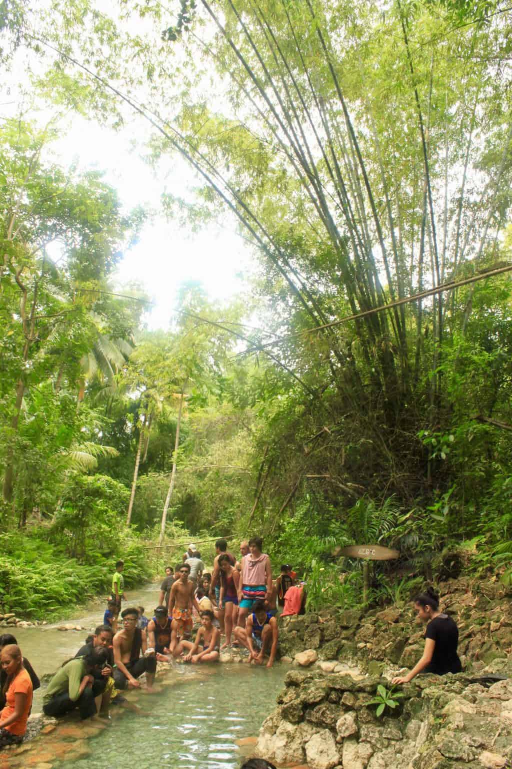 locals enjoying Mainit Hot Springs