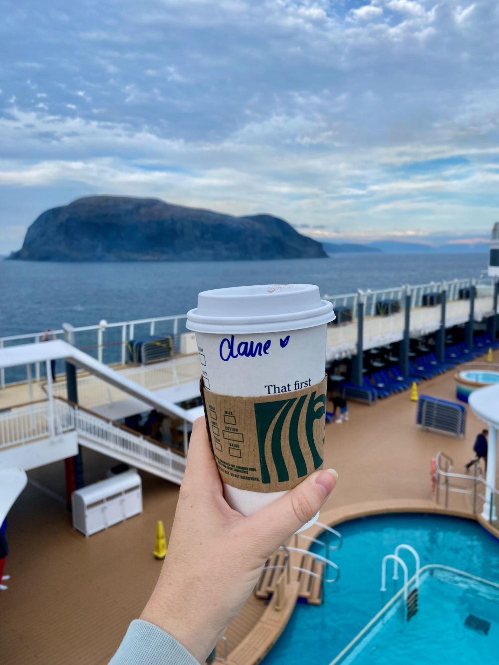 Enjoying my Starbucks up on deck on the Norwegian Pearl