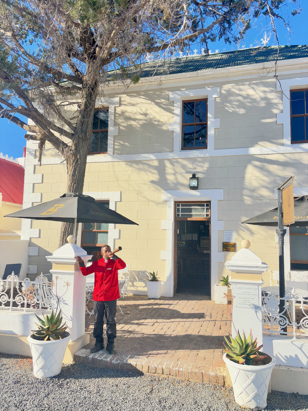 The bugler announcing the red bus tour departure in Matjiesfontein