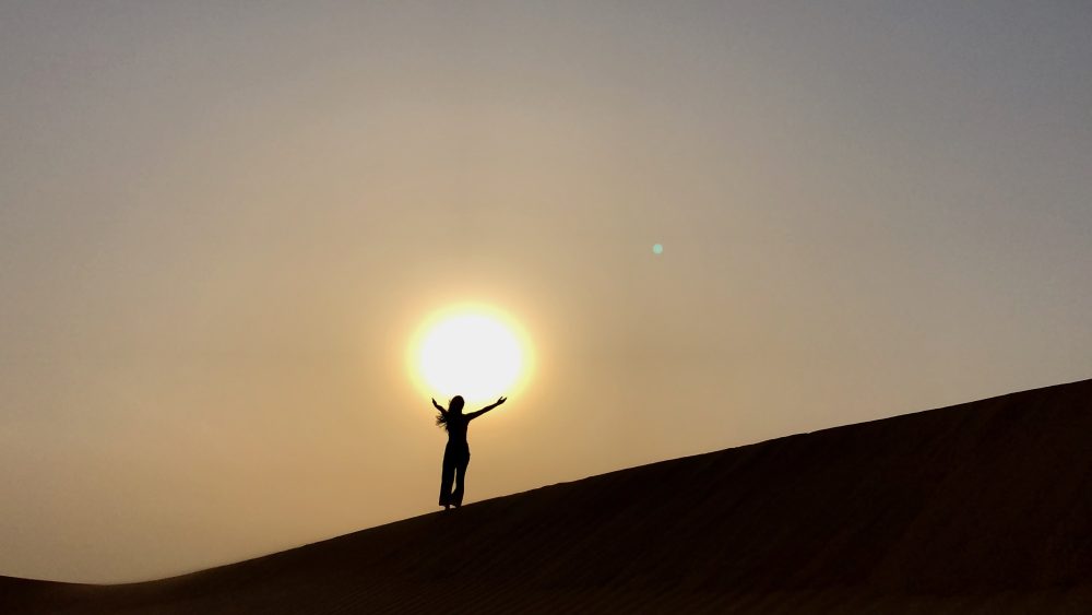 Taking in the sunset from the dunes in the Dubai desert