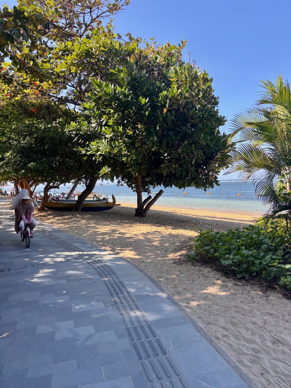 Cycling along Sanur's promenade