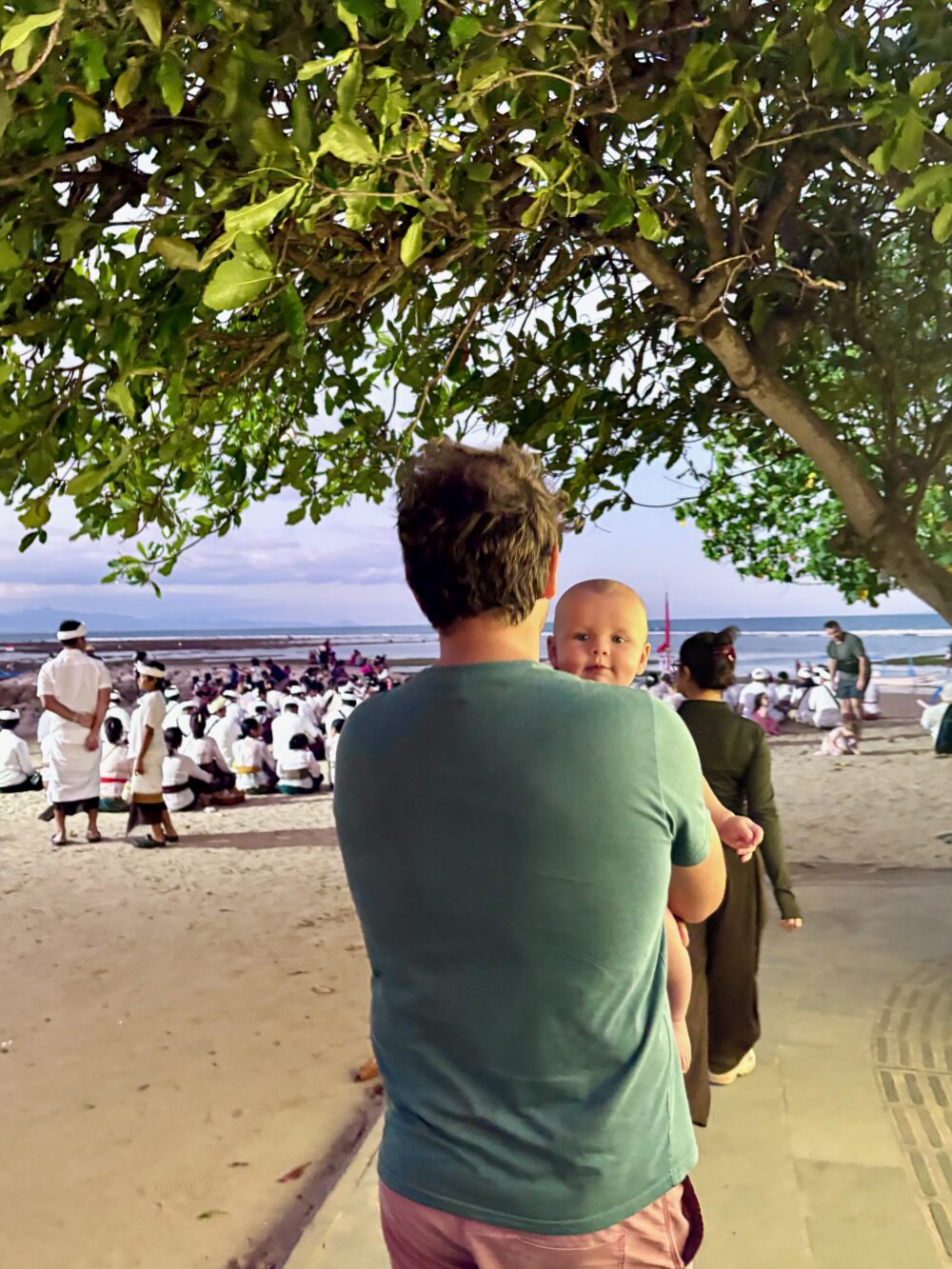 Watching a traditional ceremony on the beach in Sanur