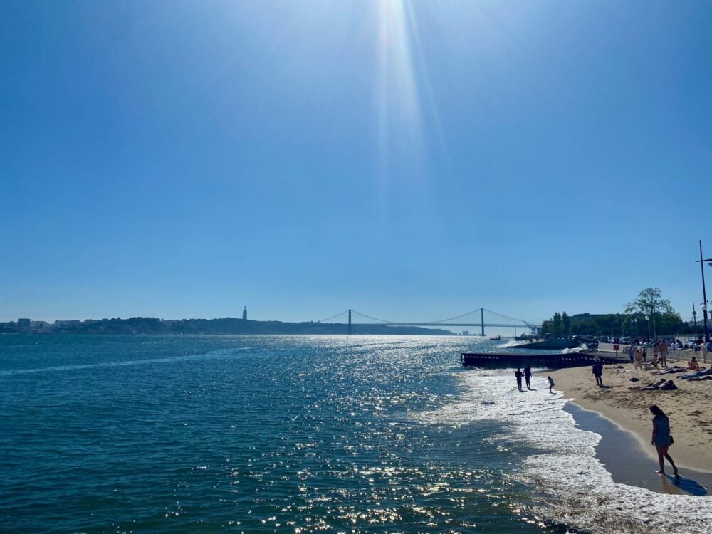 Sunny view across the Tagus River towards the 25 de Abril Bridge, Lisbon