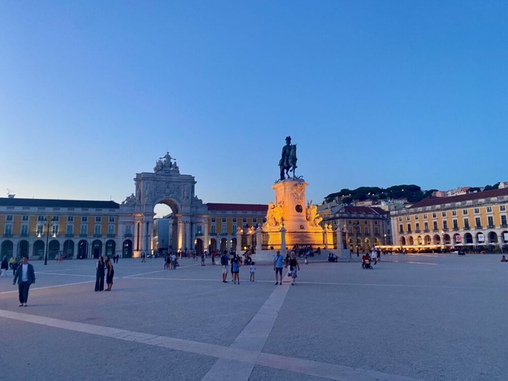 Praça do Comércio and the Arco da Rua Augusta lit up at dusk in Lisbon